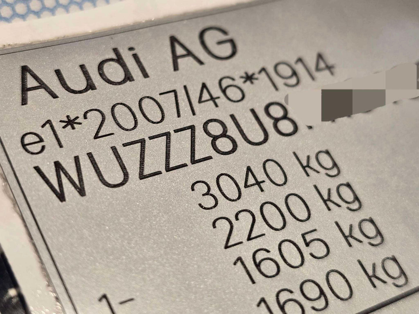 Close-up of Audi replacement VIN stickers UK showing vehicle identification and weight specifications