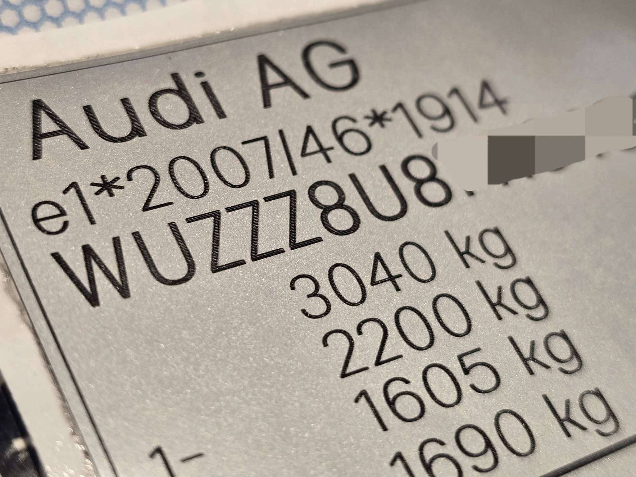 Close-up of Audi replacement VIN stickers UK showing vehicle identification and weight specifications