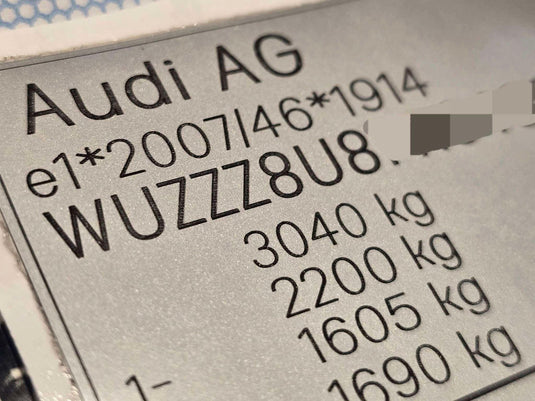 Close-up of Audi replacement VIN stickers UK showing vehicle identification and weight specifications