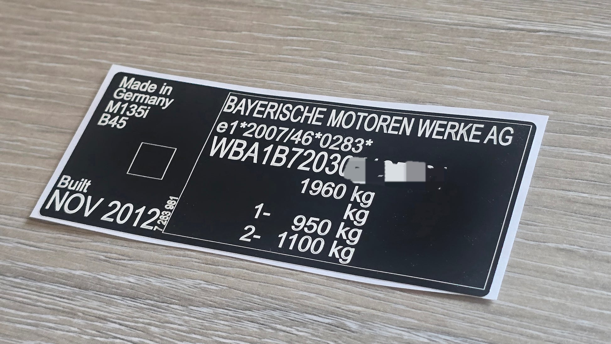 BMW 135i replacement VIN sticker UK showing vehicle details made in Germany by Bayerische Motoren Werke AG