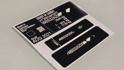 BMW M5 competition replacement VIN sticker set with vehicle details and compliance markings