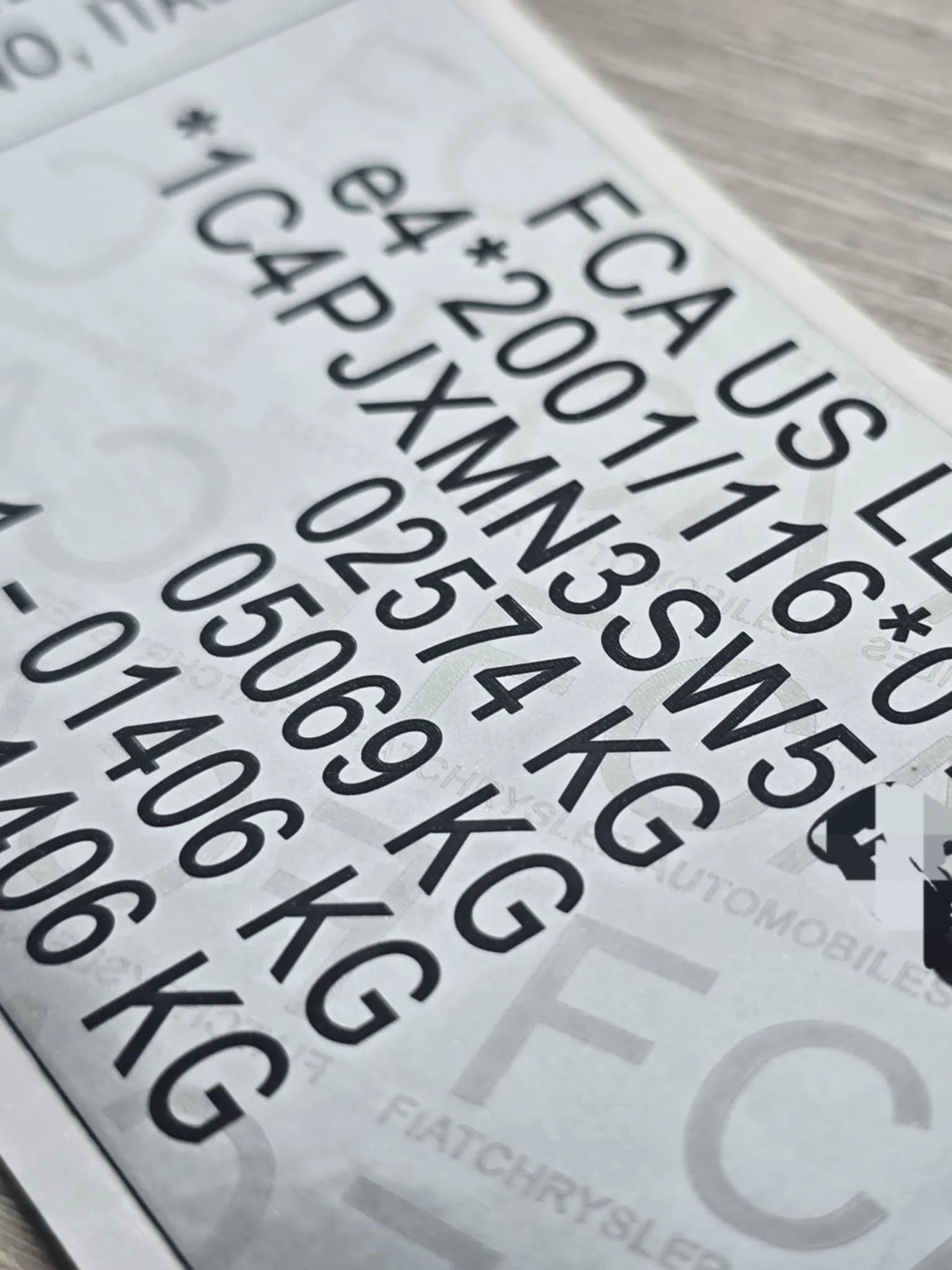 Close-up of Jeep VIN replacement stickers UK showing clear vehicle identification numbers and weight details