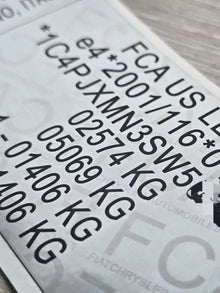 Close-up of Jeep VIN replacement stickers UK showing clear vehicle identification numbers and weight details