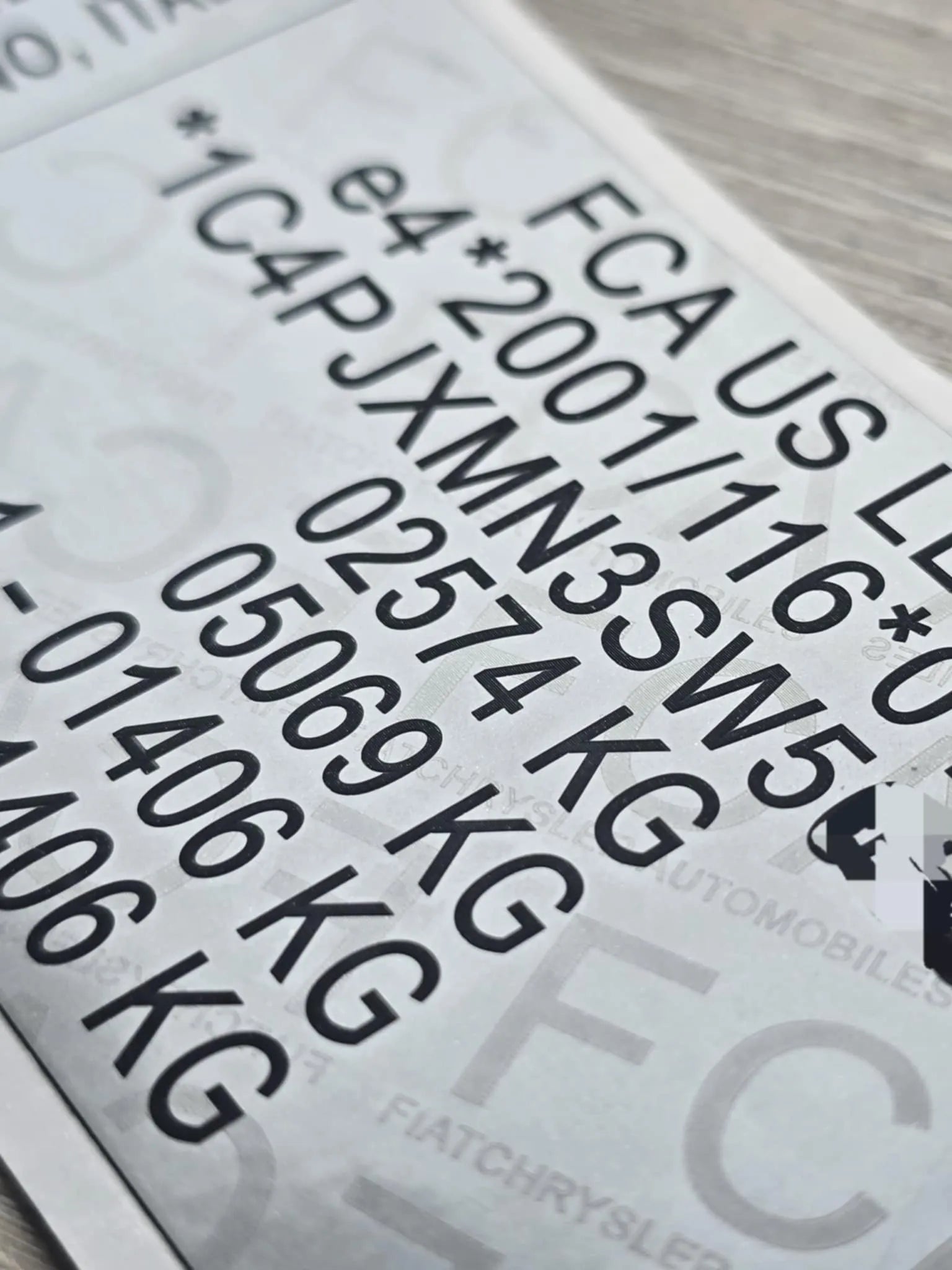 Close-up of Jeep VIN replacement stickers UK showing clear vehicle identification numbers and weight details