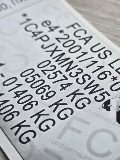 Close-up of Jeep VIN replacement stickers UK showing clear vehicle identification numbers and weight details