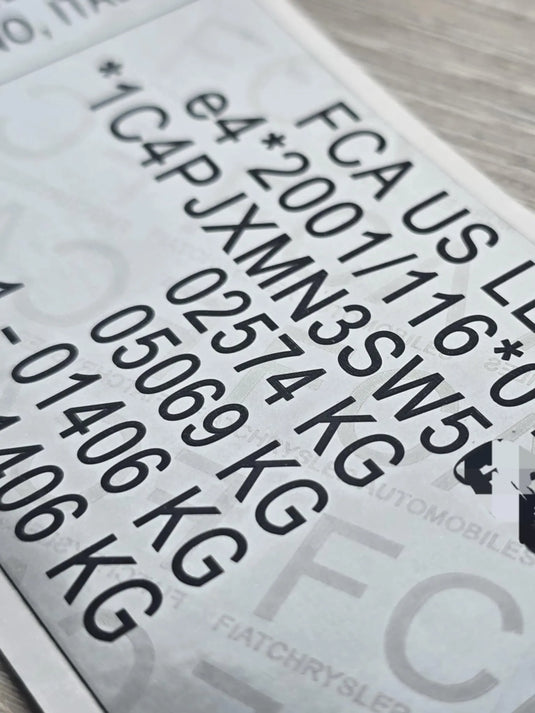 Close-up of Jeep VIN replacement stickers UK showing clear vehicle identification numbers and weight details