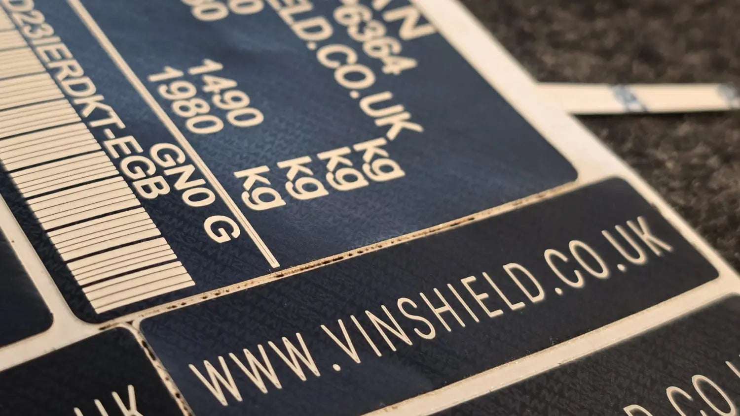 Anti-tamper VIN label and vehicle identification sticker for USA market vehicles