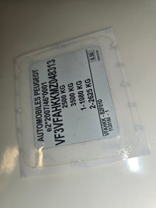 White VIN sticker with vehicle data for Peugeot including VIN number and weight details from VINSHIELD UK