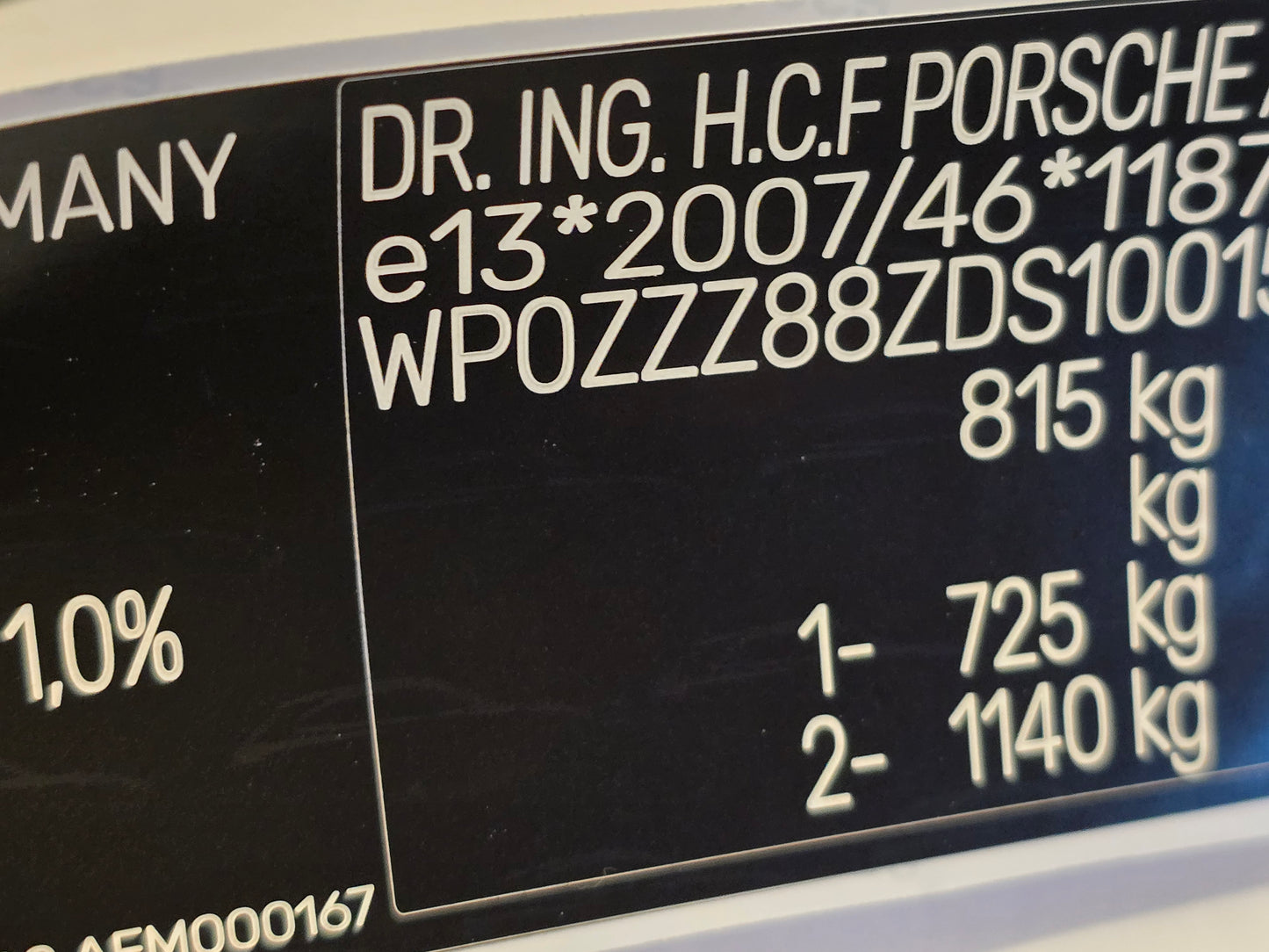 Close-up of a Porsche VIN label replacement UK showing vehicle identification and weight specifications