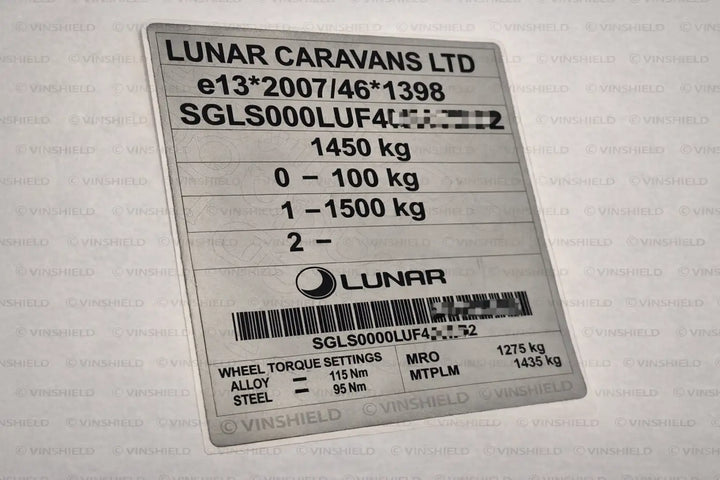 Silver metallic label with black printed text and barcode, featuring specifications for a lunar caravans ltd vehicle component.