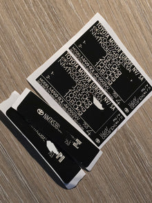 VINSHIELD UK vin stickers chassis plates vin tags data plates and anti tamper vin labels on wooden surface