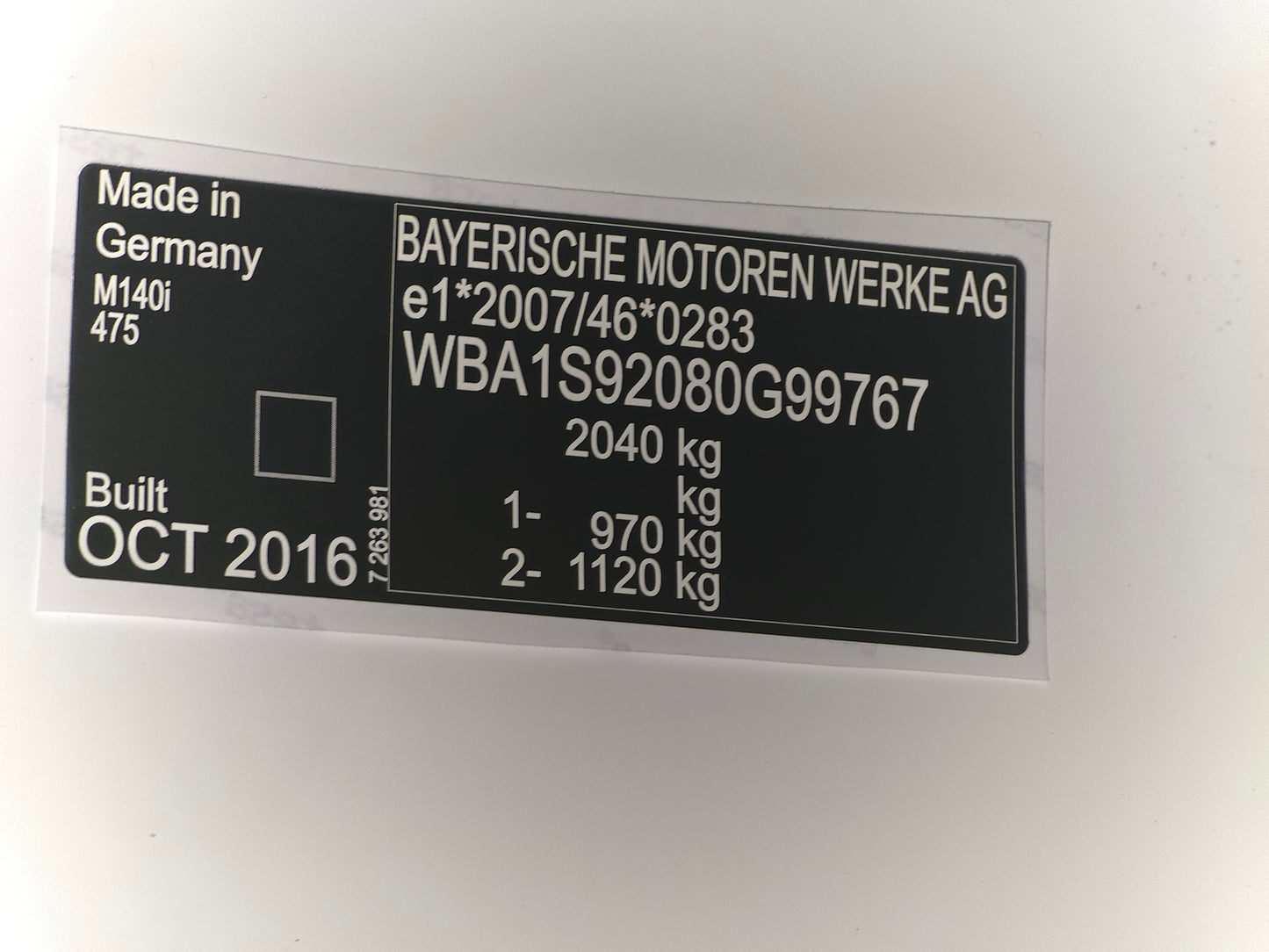 Black and silver VIN plate by VINSHIELD UK with vehicle data and serial number made in Germany