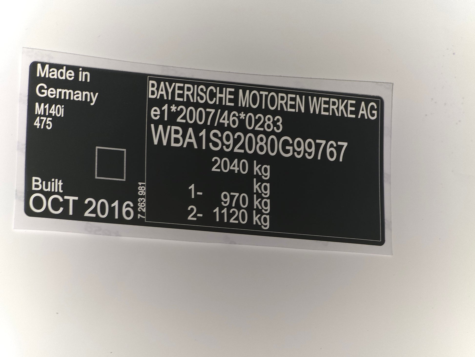 Black and silver VIN plate by VINSHIELD UK with vehicle data and serial number made in Germany