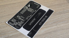 VINSHIELD UK black vin stickers chassis plates vin tags data plates and anti tamper vin labels on wooden surface